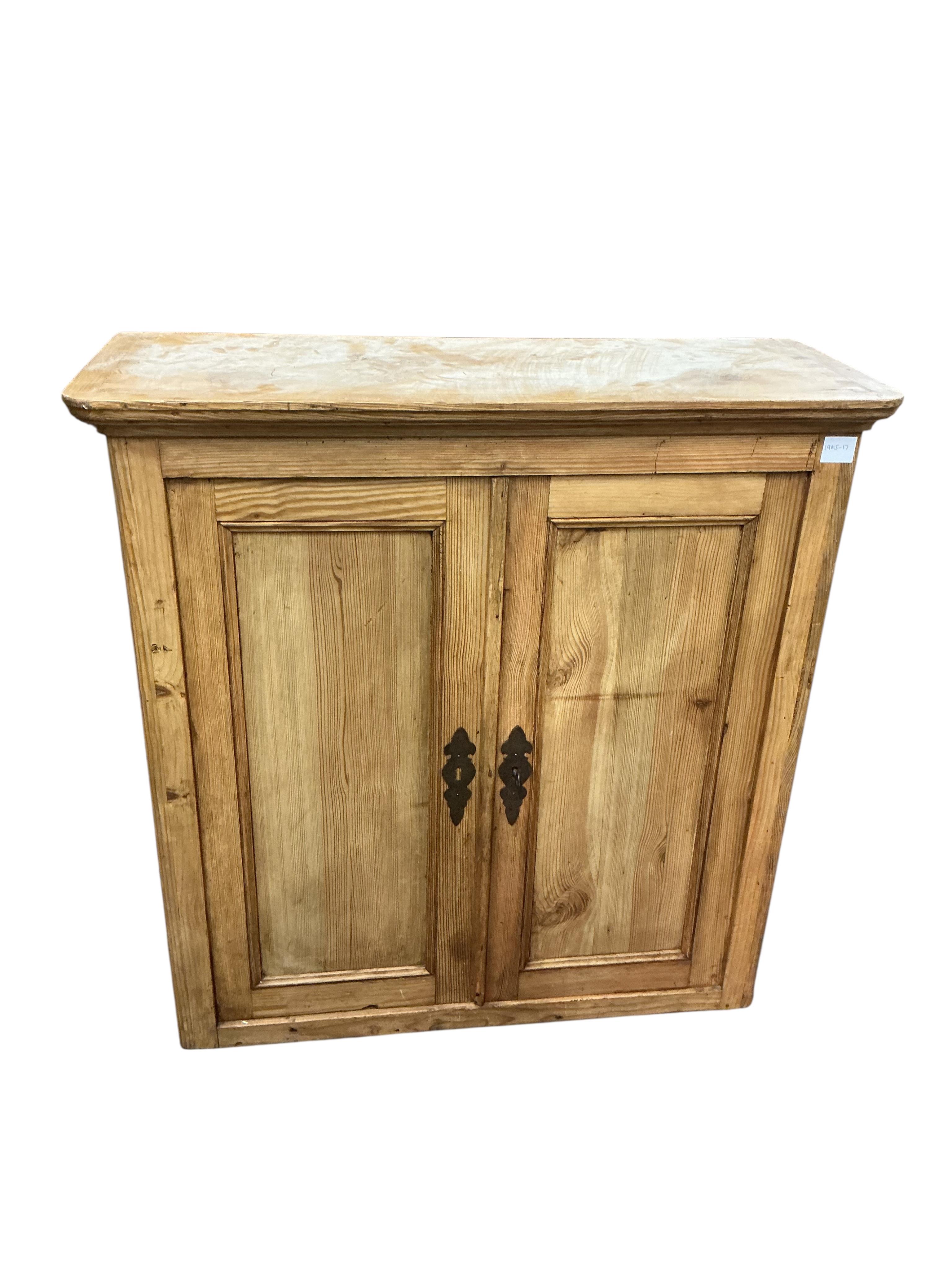 A Victorian pine two door cabinet, width 95cm, depth 37cm, height 97cm